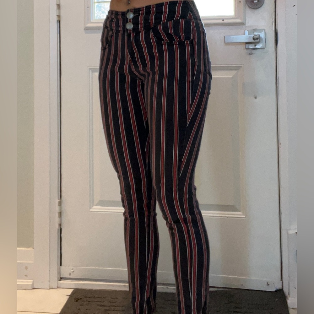 Straight leg jeans, red strips that hugs the body nicely. Best suited below 5’5